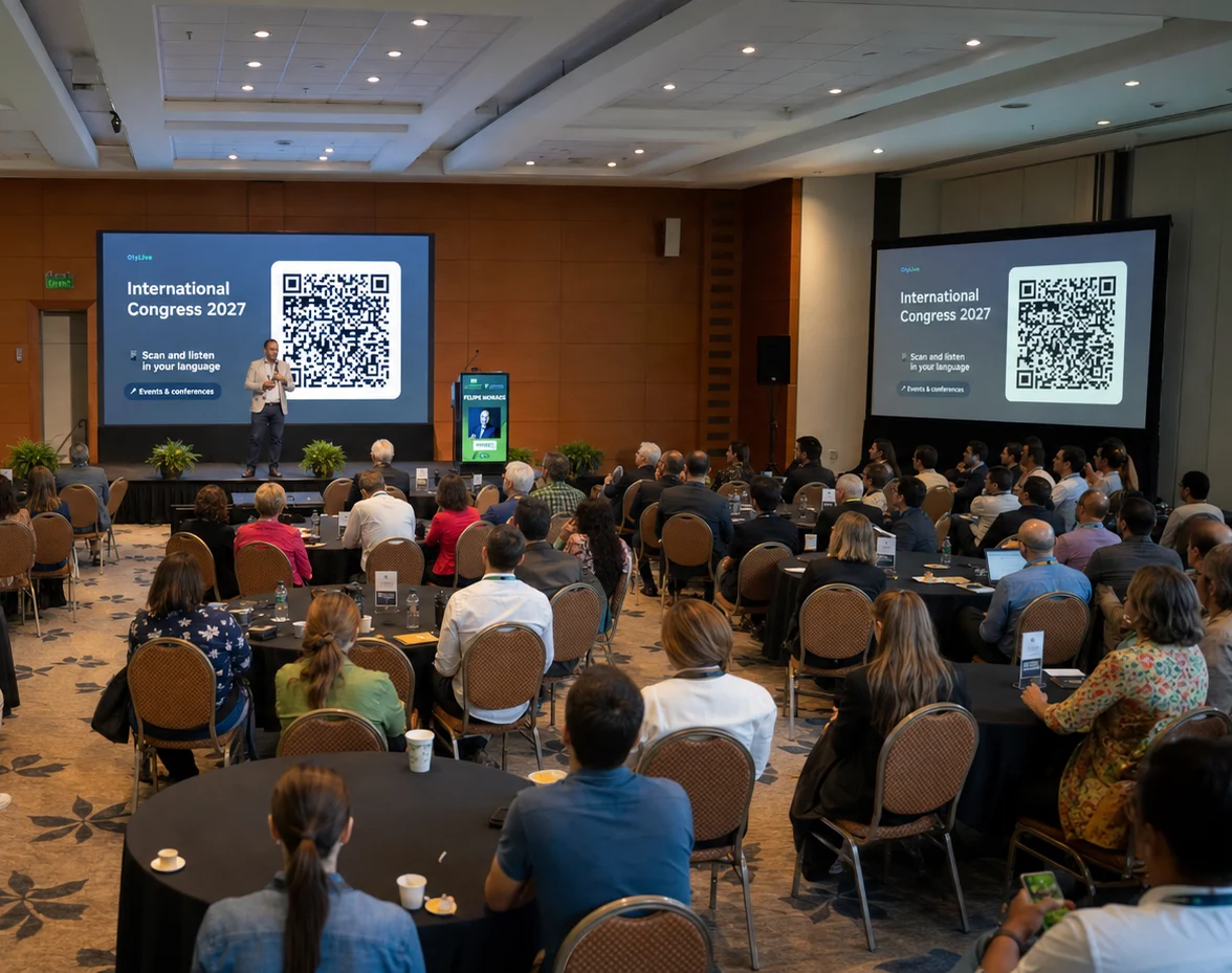 International seminar: attendees listen to the speaker in their own language while the screens show the OlyLive QR code